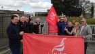 Waterford Crystal workers celebrate  the court ruling  at the old factory site yesterday. Photograph:  Mary Browne