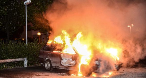 A car set on fire  following riots in the Stockholm suburb of Kista May 21st, 2013. Photograph: Reuters