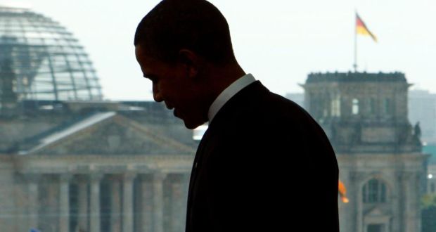  Barack Obama  standing in front of a window with a view of the  Reichstag during a meeting with German Chancellor Angela Merkel in Berlin in  2008. Photograph: Reuters.