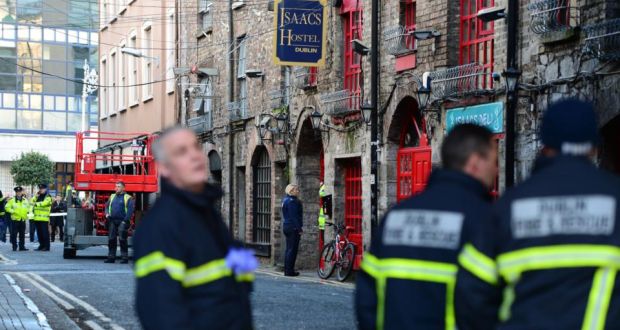 GardaÍ and firefighters at the scene on Frenchman's Lane off Store Street earlier. Photograph: Frank Miller / The Irish Times