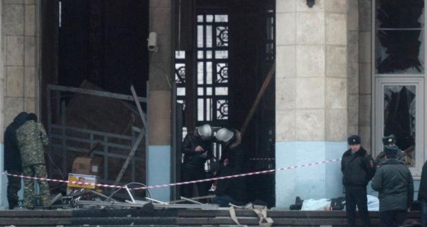 Investigators work at the site of an explosion at the entrance of a train station in Volgograd. Photograph: Sergei Karpov/Reuters