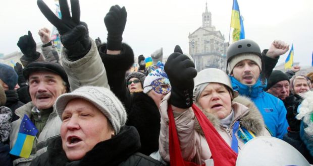 Pro-European protesters shout slogans and make hand gestures during a rally on Independence Square in Kiev. Photograph: Gleb Garanich /Reuters