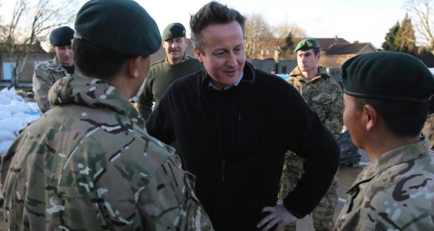 British prime minister David Cameron meets soldiers from the  Royal Gurkha Rifles, at a military command centre in Chertsey, southern England. Photograph: Paul Hackett/Reuters