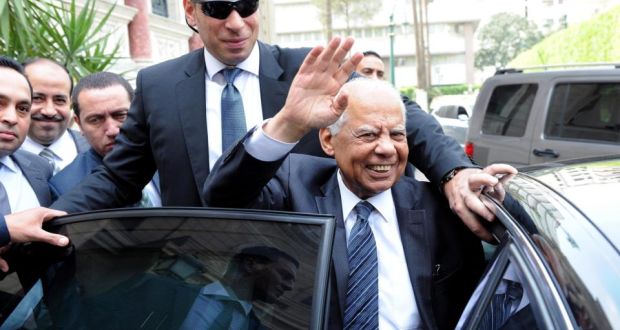 Outgoing Egyptian prime minister Hazem el-Beblawi waves as he leaves government headquarters in Cairo on Monday after announcing the government’s resignation. Photograph. EPA/STR