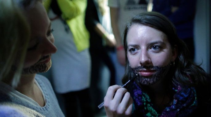 Supporters get bearded in Vienna on the night. Photograph: Georg Hochmuth/EPA - image