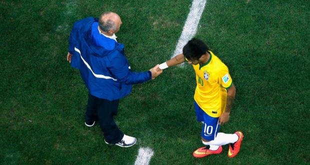 Luiz Felipe Scolari of Brazil shakes hands with Neymar as he comes off the field in the second half. Photograph: Getty Images