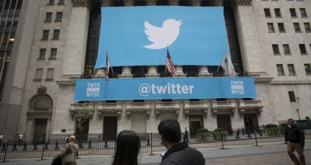 An @twitter banner is displayed on the exterior of the New York Stock Exchange. The microblogging company said revenue more than doubled to $312.2 million in the second quarter. Photo: Bloomberg