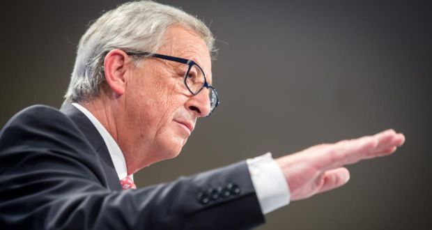European Commission president elect Jean-Claude Juncker gestures as he addresses the media on the attribution of portfolios to the Commissioners-designate at the European Commission headquarters in Brussels.