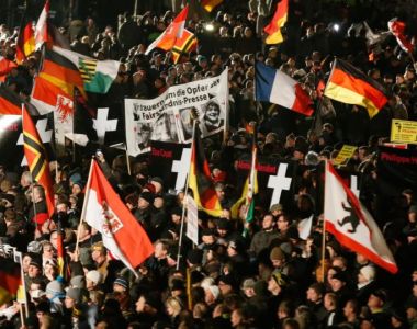 ‘These people are on the streets because they want greater involvement in decisions that affect them – before they are made.’ Above, supporters of anti-immigration movement Patriotic Europeans Against the Islamisation of the West (Pegida) hold flags during a demonstration in Dresden on January 12th. Photograph: Fabrizio Bensch/Reuters