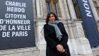 Paris Mayor Anne Hidalgo beside a banner with reads “Charlie Hebdo, Honorary citizen of Paris” in front of the Paris City Hall January 9th, 2015. Photograph: Reuters/Jacky Naegelen 