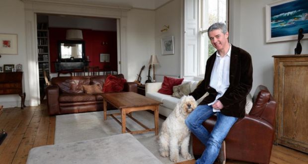 Eoin O’Mahony at Rostellan in Greystones, with Jessie the dog. “We’d rather move somewhere suitable now that will be the kids’ home forever and that will still be manageable when we’re in our 80s.” Photograph: Eric Luke / The Irish Times