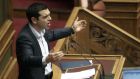 Greek prime minister Alexis Tsipras delivers a speech during a plenary session of the Parliament in Athens. Photograph: Simela Pantzartzi/EPA