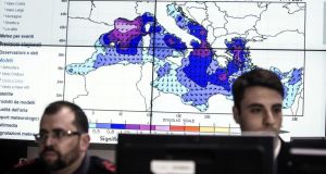 Staff  in the operations room of the Italian Coast Guard in Rome during the co-ordination of relief efforts after a ship carrying hundreds of migrants capsizes off Libyan coast occurred in the Strait of Sicily.  Photograph: Angelo Carconi/EPA 