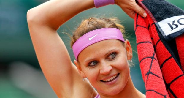 Lucie Safarova reacts after winning against Maria Sharapova during their fourth round match at the French - image