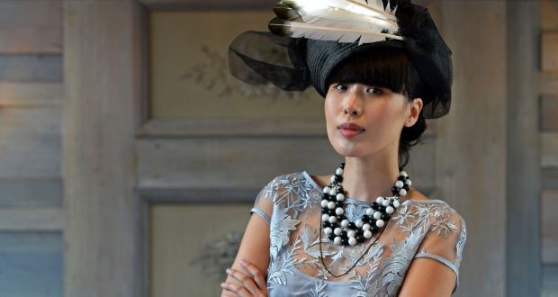 Model Yomiko Chen wears a hat by Marie-Claire Ferguson and jewellery by Melissa Curry at the launch of the Arthur Cox fashion showcase. Photograph: Eric Luke/The Irish Times