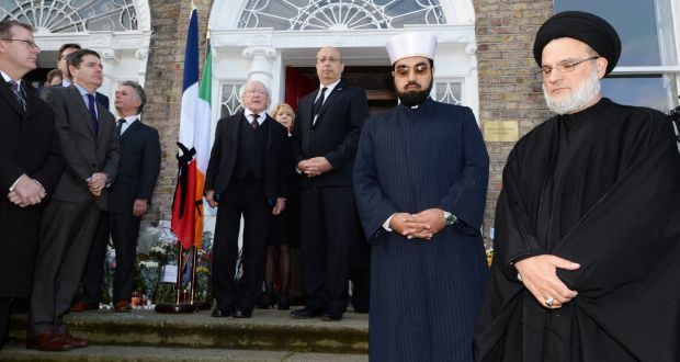  The scene during the minute’s silence at the French Embassy in Dublin where the Presient Micheal D Higgins and his wife Sabina were among the crowd gathered to honour  those who died and were injured in the Paris attacks. Photograph: Cyril Byrne