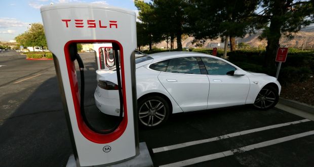 A Tesla Model S charges at a Supercharger station. The tech car firm has announced Irish prices for the Model S saloon and Model X SUV. It will open a store in Ireland in 2017 and install Superchargers in four sites. Photograph: Sam Mircovich/Reuters 