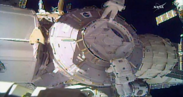 In this image made from video provided by Nasa, US astronauts Peggy Whitson, above, and Shane Kimbrough work on the outside of the International Space Station on Thursday. An important piece of micrometeorite shielding was lost during the spacewalk. Photograph: Nasa/AP