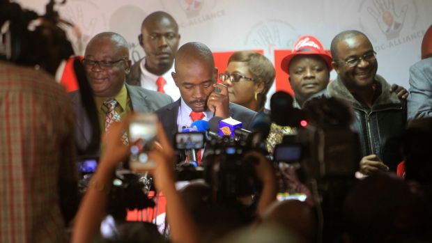   Nelson Chamisa (center) MDC opposition alliance leader at the party headquarters in Harare, Photograph: Tsvangirayi Mukwazhi / AP 