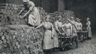 Women munition workers stacking a reserve of shell castings during WWI. Photograph:  Universal History Archive/UIG via Getty Images