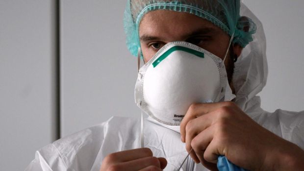 ‘What if the much needed personal protective equipment doesn’t arrive ahead of a big surge in patients?’ Above, a nurse puts on PPE in Italy. Photograph: Marco Bertorello/AFP via Getty