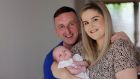Laura Curtis from Baldoyle in Dublin with her partner Robbie Dalton and their baby Demi. Photograph: Alan Betson