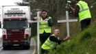 Members of the N4 Action Group erecting one of 31 crosses placed along the N4 in memory of people killed in crashes along the dangerous stretch of the Dublin to Sligo road. Photograph: Brian Farrell