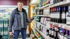 Karol Scollan at his  Gala outlet  in Drumshanbo, Co Leitrim: “I think this is going to affect the bigger supermarkets more than the smaller independent off-licences.” Photograph:  James Connolly