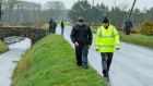 Gardaí and local volunteers search the roadside as part of the investigation into the assault in  Tom Niland in  Co Sligo. Photograph: James Connolly