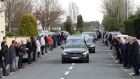 Mourners line the street as the hearse carrying the coffin of Aidan Moffitt arrives at the Christ the King church, Lisacul, Co Roscommon. Photograph: RollingNews.ie