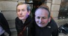  Protesters wearing masks of Enda Kenny  and Miche&aacute;l Martin.  The difficulties of bringing the two parties together are underrated. Photograph: Nick Bradshaw