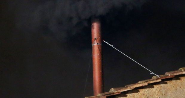 Black smoke billows out from a chimney on the roof of the Sistine Chapel indicating that the College of Cardinals have failed to elect a new Pope. Photograph: Peter Macdiarmid/Getty Images.