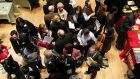 Job seekers wait to speak to representatives of employers at a job fair. Photo: Getty Images