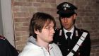  Raffaele Sollecito is escorted from a court in Perugia in 2009.  Photograph: Giuseppe Bellini/Getty Images 