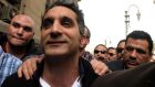 Bassem Youssef: poked fun at Mr Morsi’s repeated use of the word “love” by singing a love song to a red pillow with the president’s face printed on it. Photograph: Reuters