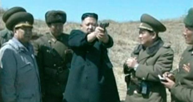 North Korea’s leader Kim Jong-un holds up a pistol as he supervises firing drills with the  North Korea People’s Army (KPA), in this still image taken from video footage released by the North's state-run television KRT yesterday