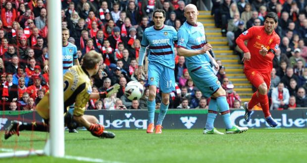 Liverpool's Luis Suarez shoots at goal during the  Premier League match against West Ham  at Anfield. Photograph:  Martin Rickett/PA 