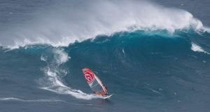 Katie McAnena windsurfs the Pe’ahi wave known as Jaws, off the Hawaiian island of Maui: “There were big gaps in the swell, so I timed it and it just seemed like it was right.” Photograph: John Carter