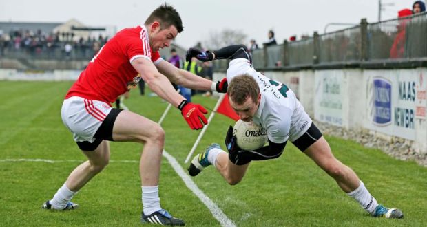 Kildare's Alan Smith is bundled over the sideline by Conor Gormley during the league game in Newbridge last month. Photograph: Morgan Treacy/Inpho