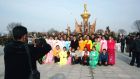 Workers take a photograph during a visit to the plaza park of Kumsusan Palace of the Sun in Pyongyang, to commemorate the 101st anniversary of the birth of North Korea's founder Kim Il-sung yesterday. Photograph: Korean Central News Agency/Reuters  