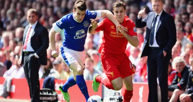 Seamus Coleman of Everton battles for the ball with Jordan Henderson of Liverpool at Anfield. Photograph: Laurence Griffiths/Getty Images