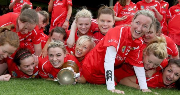 Cork players celebrate with the National League trophy after their victory over Wexford at Nowlan Park.  Photograph: Ryan Byrne/Inpho