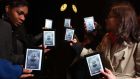 Kindle users receive their pre-ordered copy of the new Dan Brown novel Inferno on their Kindle  devices as the clock on Big Ben in London’s Westminster strikes midnight, ahead of the book’s release in shops today. Photograph: Geoff Caddick/PA