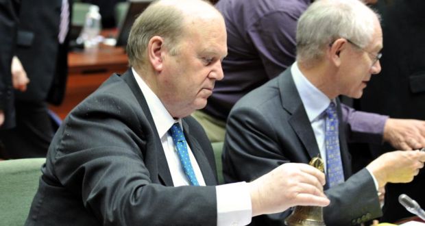 Minister for Finance Michael Noonan rings the bell prior to an economic and financial affairs meeting yesterday, at the EU headquarters in Brussels. 