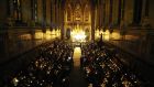 People hold candles at the annual Console “service of light” in St Patrick’s Chapel,  Maynooth College, last December, to remember those who have died by suicide. Photograph: Aidan Crawley