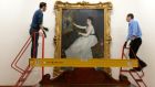 Simon Lawlor  and Peter Billing hanging the Edouard Manet portrait of Eva Gonzales at the Hugh Lane Gallery as part of the Hugh Lane Collection, which returned from the National Gallery in London Photograph: Cyril Byrne/The Irish Times