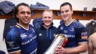One for the road: Leinster back Isa Nacewa, coach Joe Schmidt and outhalf Jonathan Sexton with the silverware they won in their final game for the province last night. Photograph: Dan Sheridan/Inpho