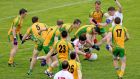 Tyrone’s Sean Cavanagh is surrounded by a pack of Donegal players in Ballybofey