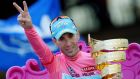 Astana’s Vincenzo Nibali of Italy holds the trophy as he celebrates after yesterday’s last stage of the Giro d’Italia from Riese Pio X to Brescia. Photograph: Reuters