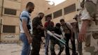 Free Syrian Army fighters prepare to launch a rocket in Deir al-Zor. International estimates put the number of Free Syrian Army fighters and assorted jihadists at about 70,000. Photograph: Reuters/Khalil Ashawi